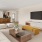 a living room with a tv and couches