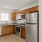 kitchen with ample counter-space, modern appliances and bright lighting