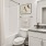bathroom area with a mirror and ample counter-space