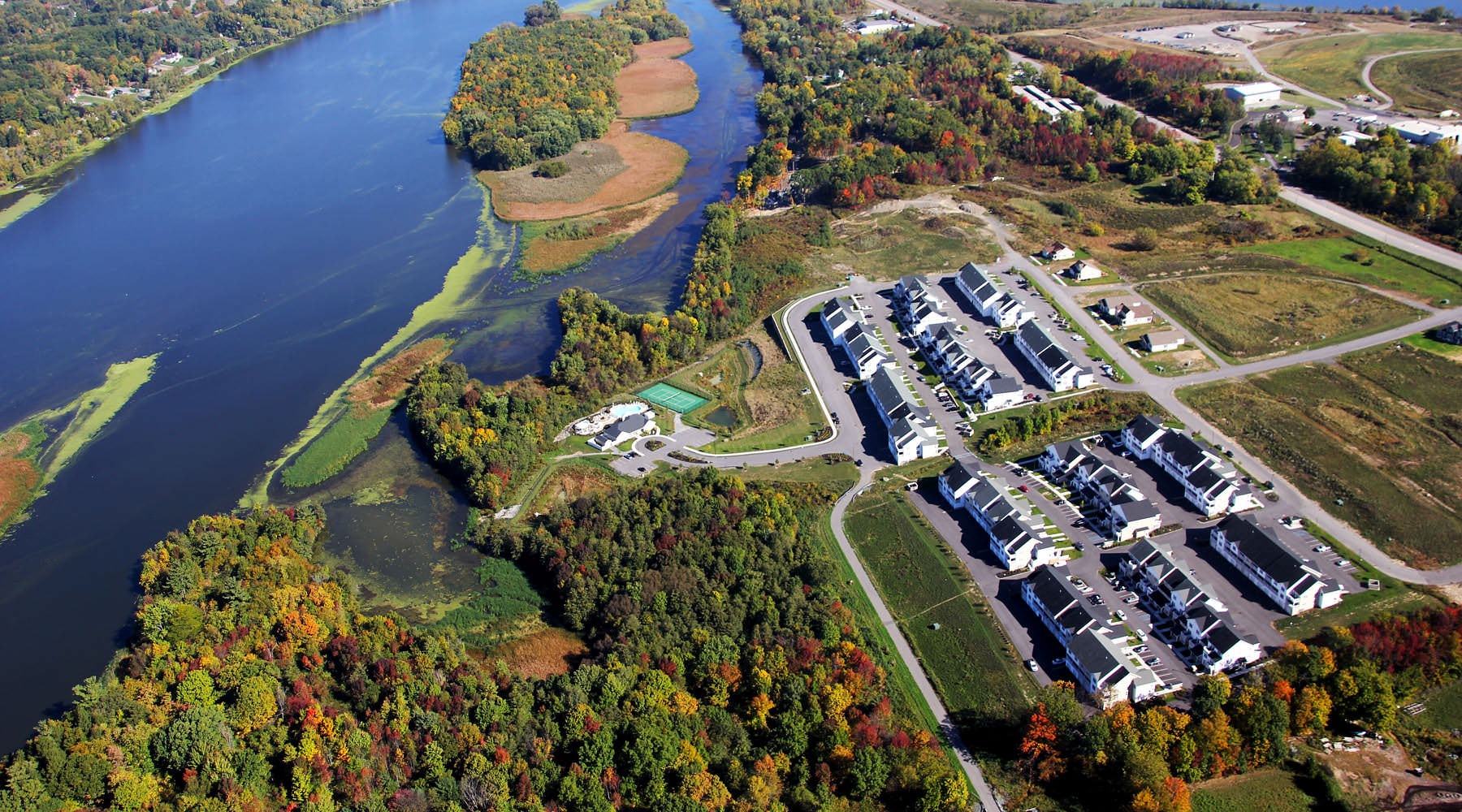 READY TO TAKE A TOUR? aerial shot of Shelter Cove near water way